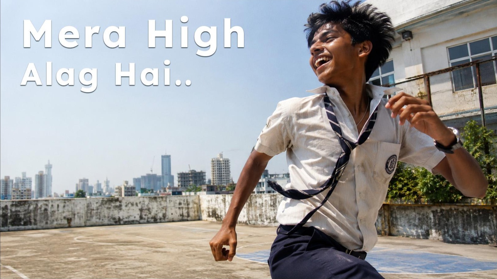 Student running across a rooftop with the campaign line Mera High Alag Hai